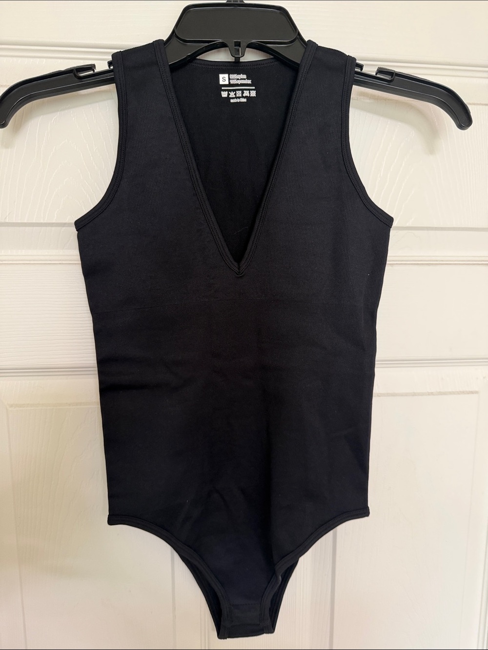 Woman’s OQQ Black V-Neck One-Piece Bodysuit